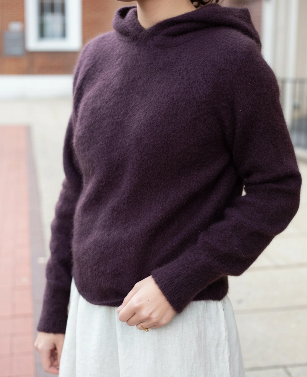 Mara hoodie worn - versatile sustainable knitwear
